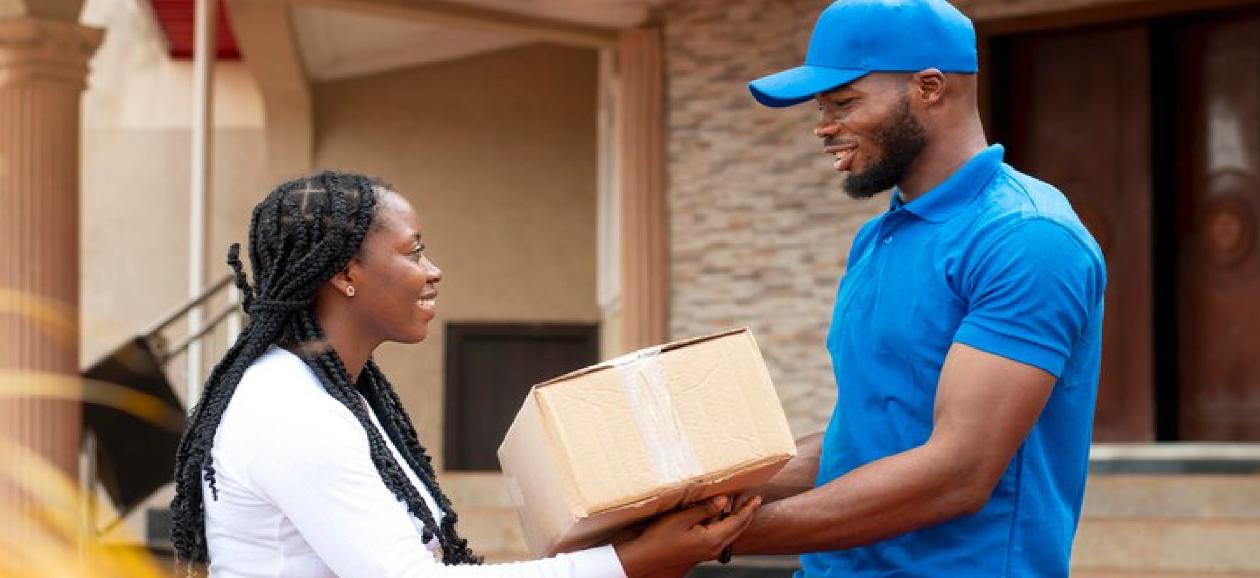 delivery-person-giving-parcel-client-01